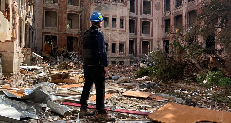 3D laser scanning expert Emmanuel Durand stands in the rubble at a war-damaged University in Kharkiv, Ukraine.