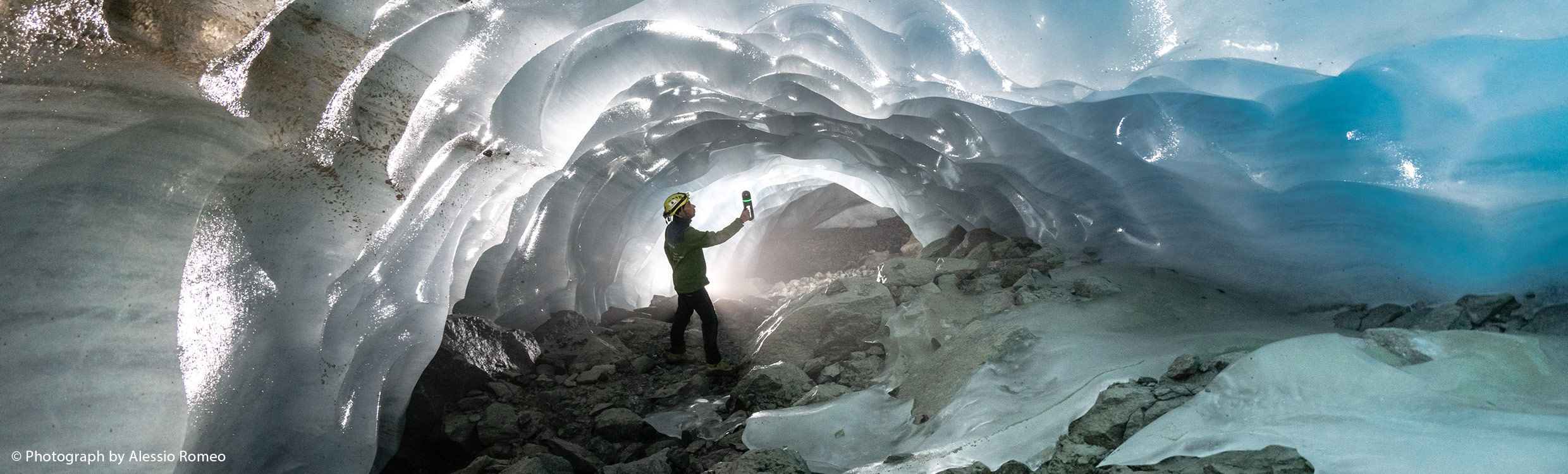 a-man-crouched-glacier2480x750